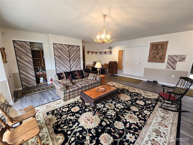 living room with wood-type flooring and a chandelier