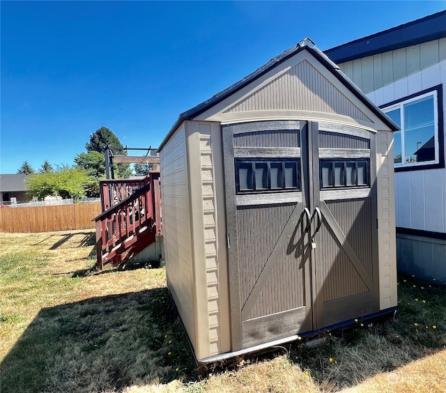 view of outbuilding with a lawn