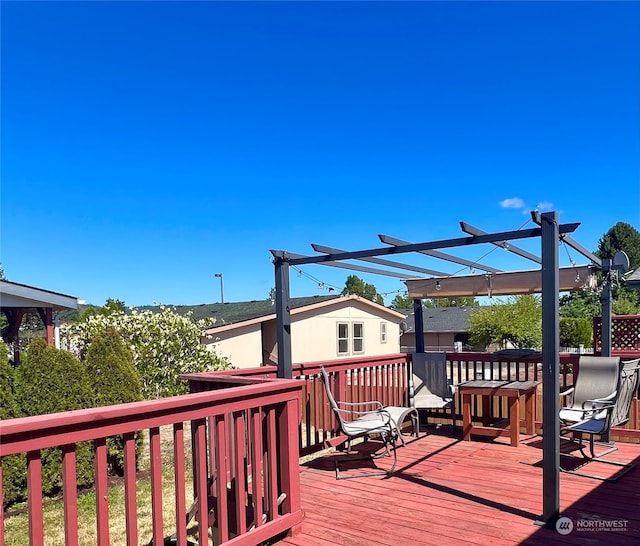 wooden deck with a pergola