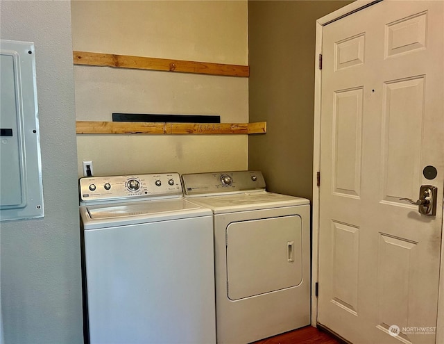 clothes washing area featuring washing machine and clothes dryer and electric panel