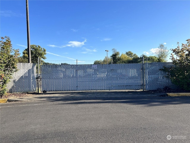 view of gate with fence