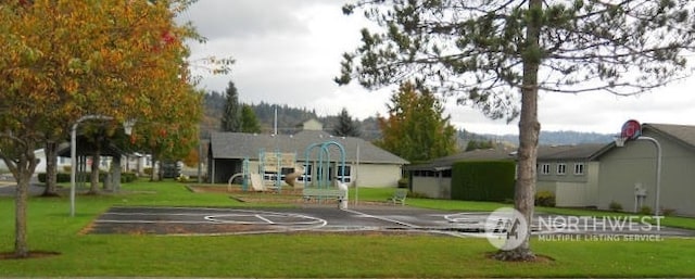 exterior space featuring a playground and a lawn