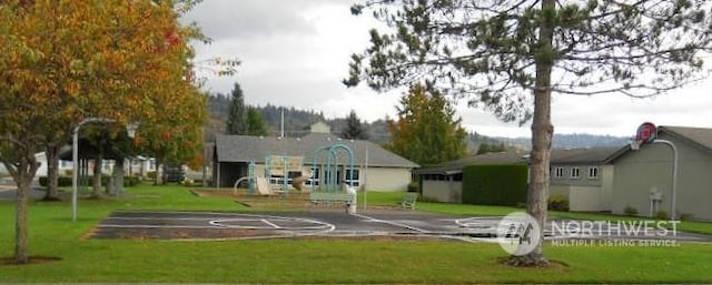 view of sport court with community basketball court and a yard