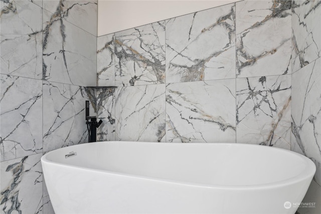 bathroom featuring a tub to relax in