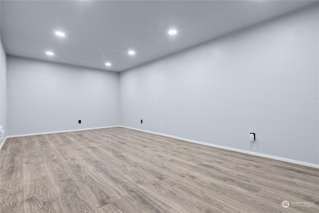 spare room with light hardwood / wood-style floors