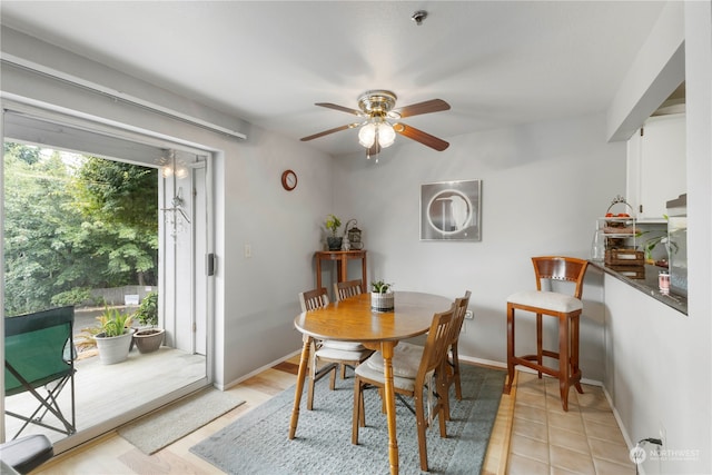 dining room featuring light wood-type flooring and ceiling fan