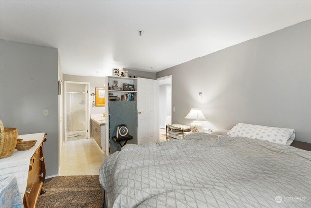 tiled bedroom with connected bathroom