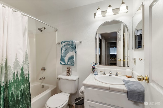 full bathroom featuring vanity, shower / bath combo, and toilet