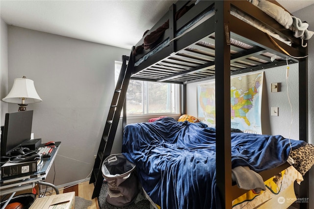 bedroom featuring hardwood / wood-style floors