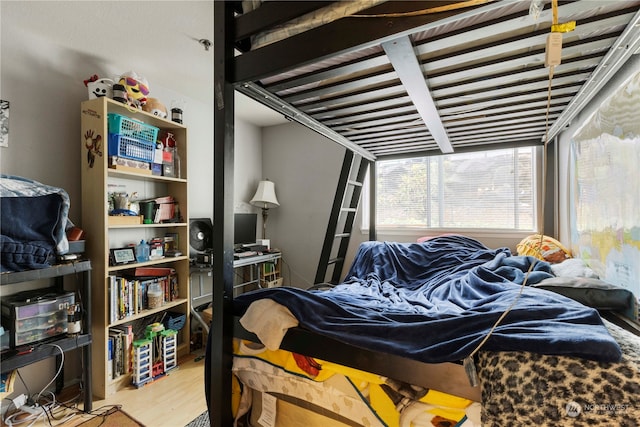 bedroom with light hardwood / wood-style floors