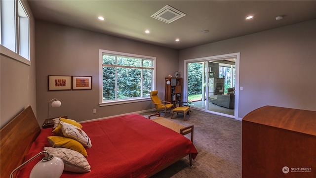 carpeted bedroom featuring access to exterior