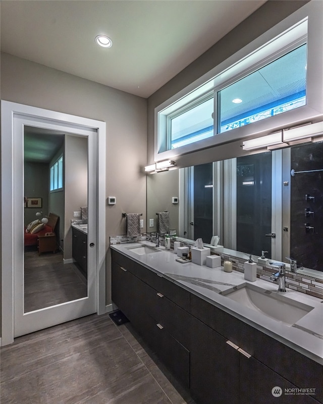 bathroom featuring dual vanity