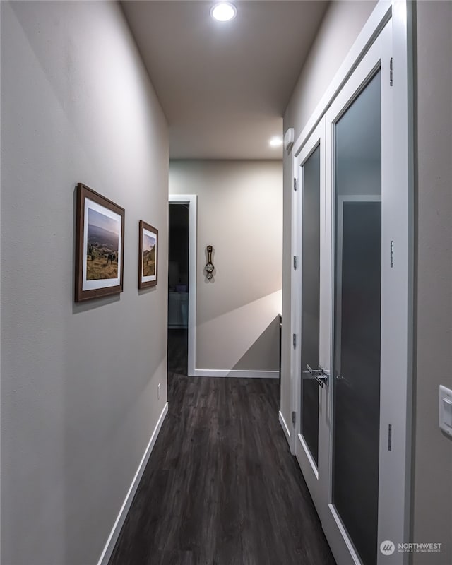 hall with dark hardwood / wood-style floors