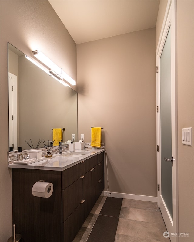 bathroom with tile patterned flooring and double vanity