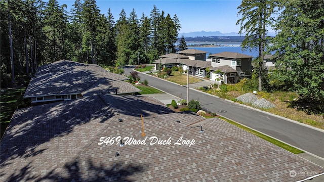 birds eye view of property with a water view