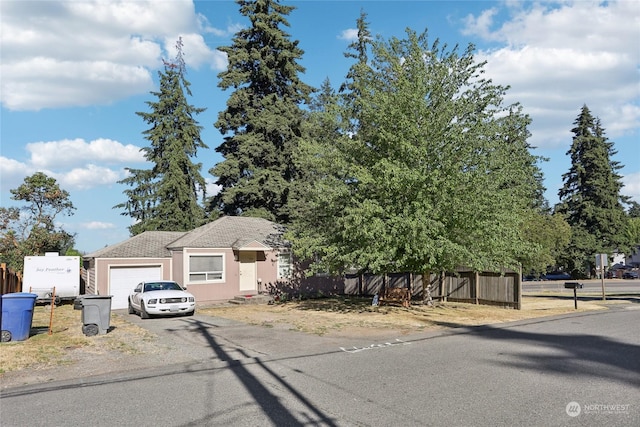 view of front of house featuring a garage and aphalt driveway