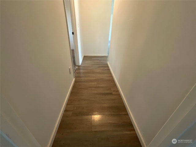 hall with dark hardwood / wood-style flooring