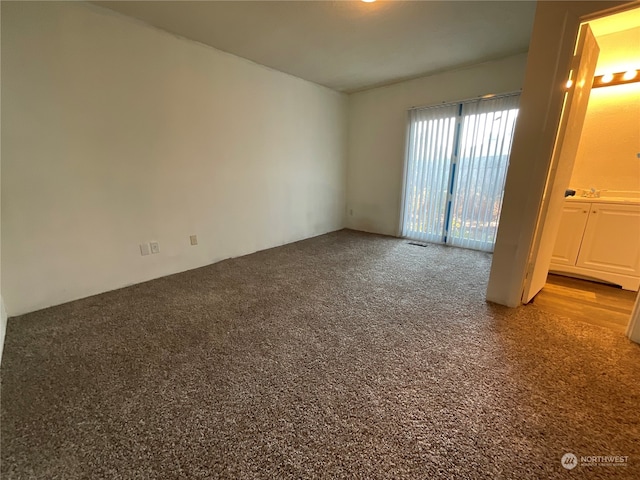 unfurnished bedroom featuring light carpet