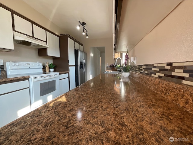 kitchen featuring stainless steel fridge with ice dispenser, white cabinets, rail lighting, white electric stove, and sink