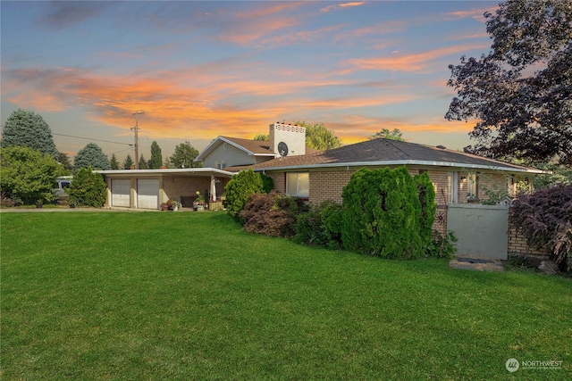 view of front of home with a lawn