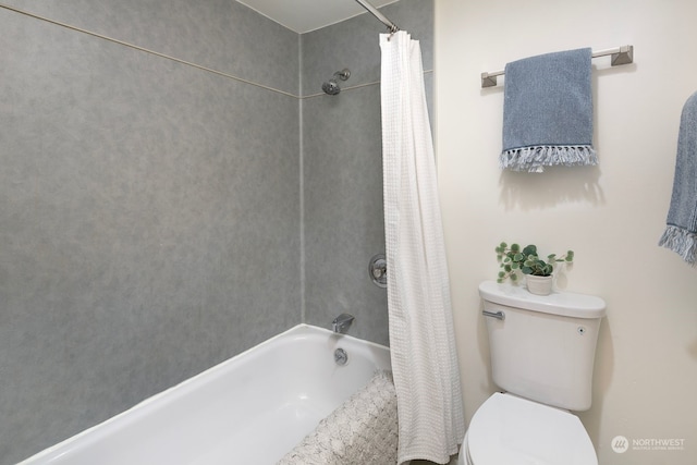 bathroom featuring shower / bathtub combination with curtain and toilet