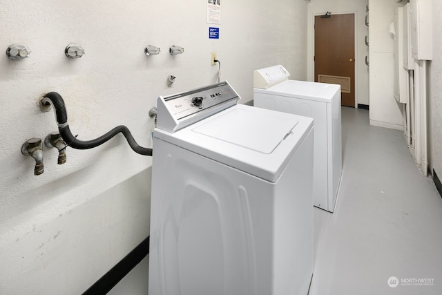 laundry room featuring separate washer and dryer