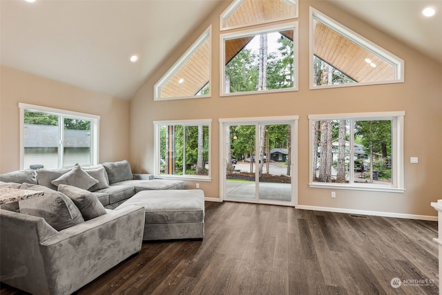 living room featuring high vaulted ceiling, baseboards, dark wood-type flooring, and recessed lighting
