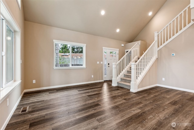 interior space featuring hardwood / wood-style flooring and high vaulted ceiling