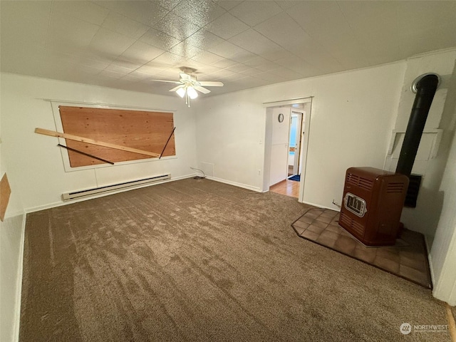 interior space with dark carpet, a baseboard radiator, ceiling fan, and a wood stove