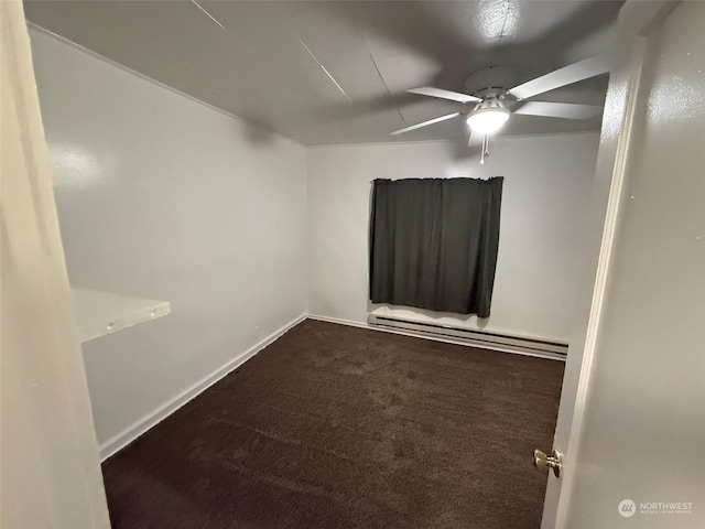 empty room with a baseboard heating unit, carpet floors, and ceiling fan