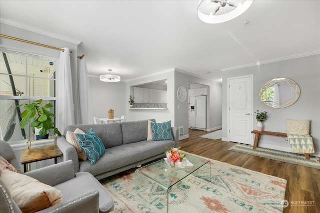 living room featuring crown molding and hardwood / wood-style floors