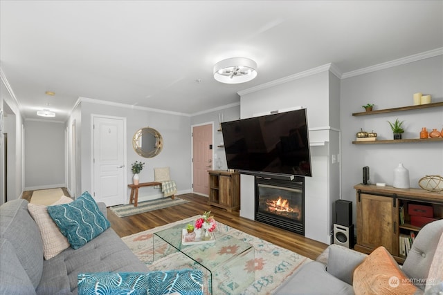 living room featuring wood-type flooring and ornamental molding