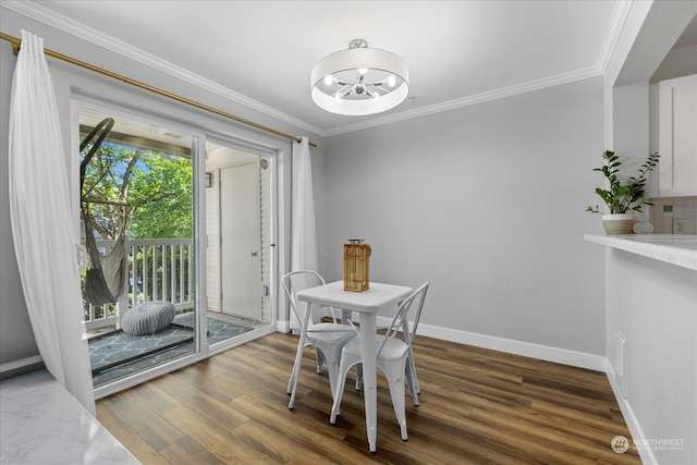 dining room featuring crown molding and hardwood / wood-style floors