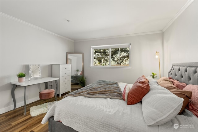 bedroom with hardwood / wood-style flooring and ornamental molding