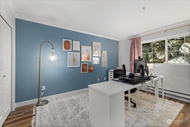 office with ornamental molding, baseboard heating, and dark wood-type flooring