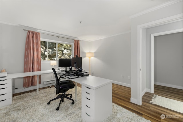 office area featuring baseboard heating, wood-type flooring, and ornamental molding