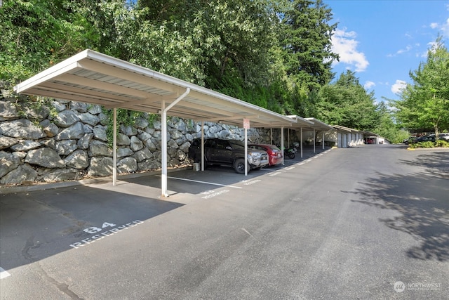 view of vehicle parking featuring a carport