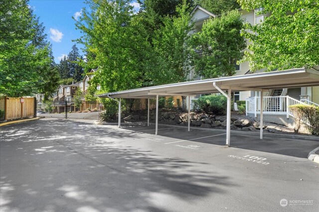 view of vehicle parking featuring a carport