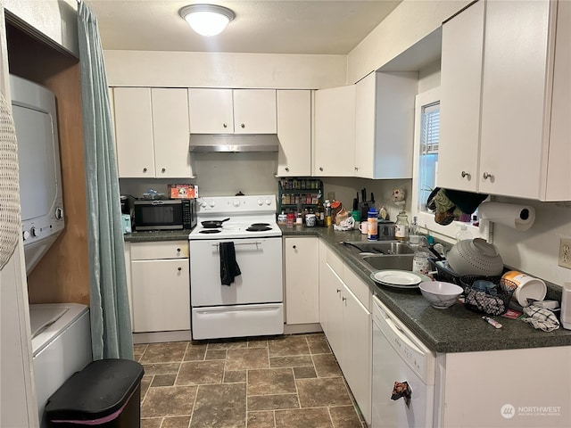 kitchen with sink, white cabinets, dark tile patterned flooring, and white appliances