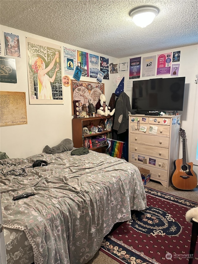 carpeted bedroom with a textured ceiling