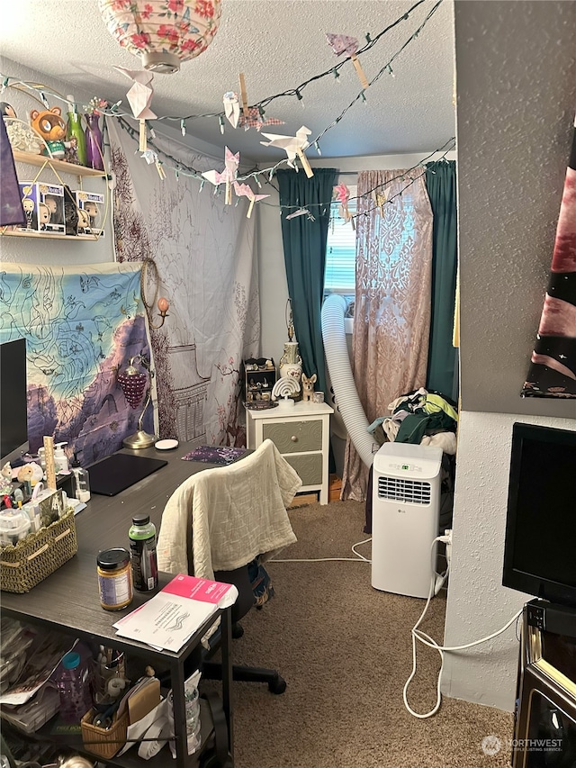 office space featuring carpet floors and a textured ceiling