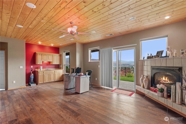 kitchen with sink, hardwood / wood-style floors, a mountain view, wooden ceiling, and light brown cabinets