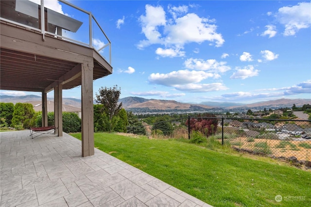 exterior space featuring a balcony and a mountain view