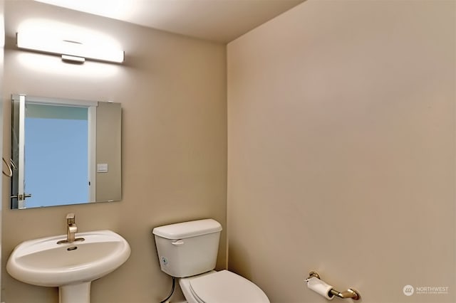 bathroom with sink and toilet