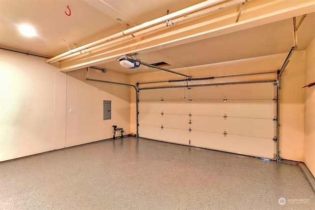 garage featuring a garage door opener and electric panel