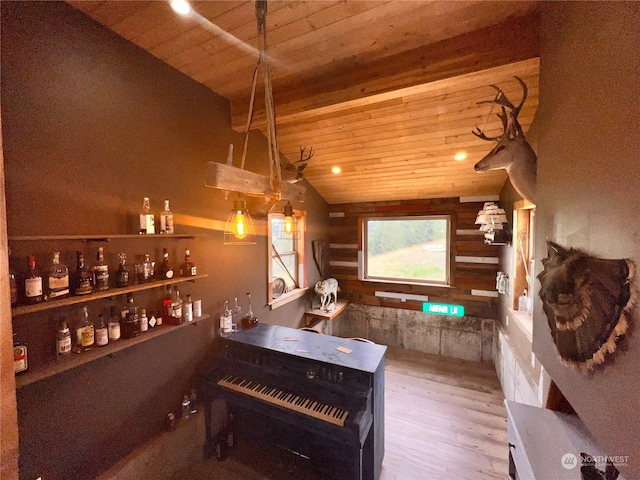 bar featuring hardwood / wood-style floors, wooden ceiling, and vaulted ceiling