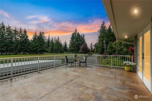 view of patio featuring a balcony