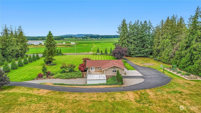 birds eye view of property with a rural view