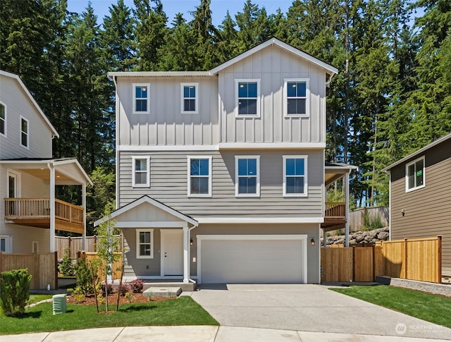 view of front facade with a balcony and a garage