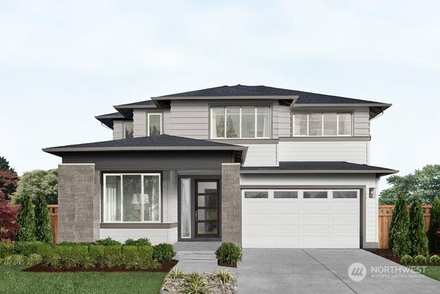 prairie-style house featuring a garage